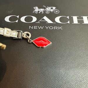 Coach hang tag Lip Charm in Vibrant Red